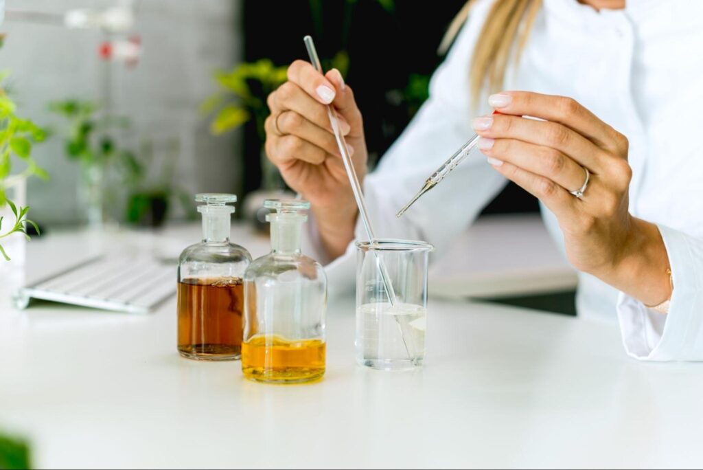 Scientist conducting experiments with Vitamin C derivatives in a laboratory setting.