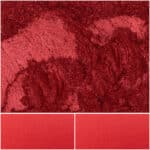 Vibrant red eye shadow with shimmering texture for bold makeup looks.