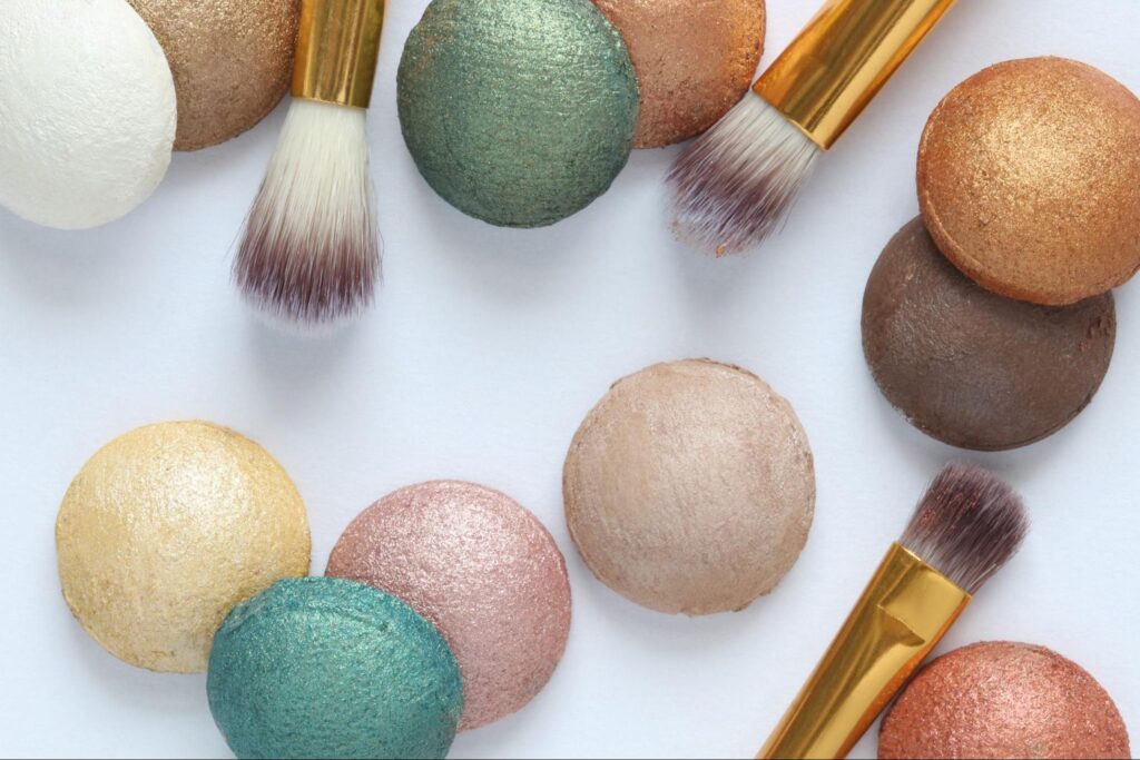 Colorful makeup powders and brushes for creating stunning beauty looks.