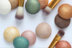 Colorful makeup powders and brushes for creating stunning beauty looks.