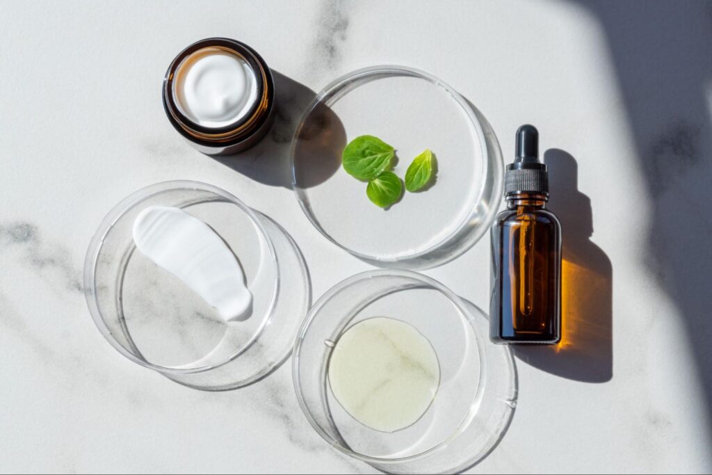 Elegant marble surface with natural skincare products and essential oils.