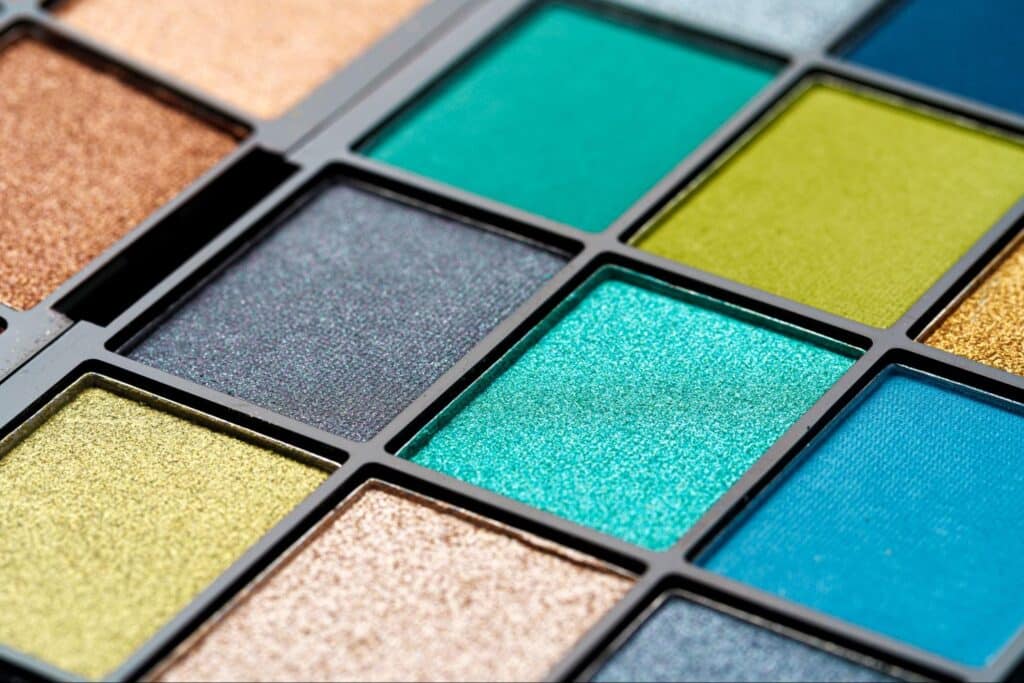 Vivid blue and green eyeshadow palette for eye-catching makeup styles.